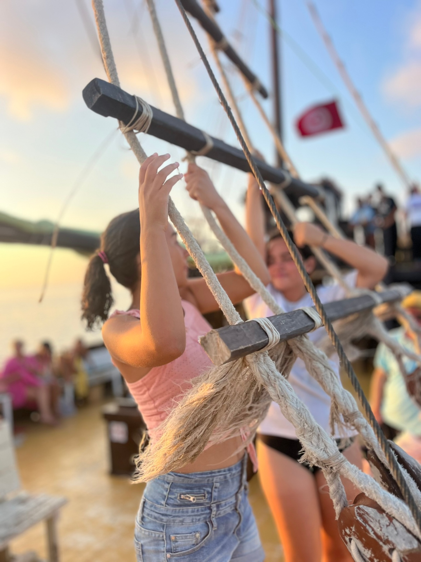 adventurous child on the ropes pirate ship Djerba sunset